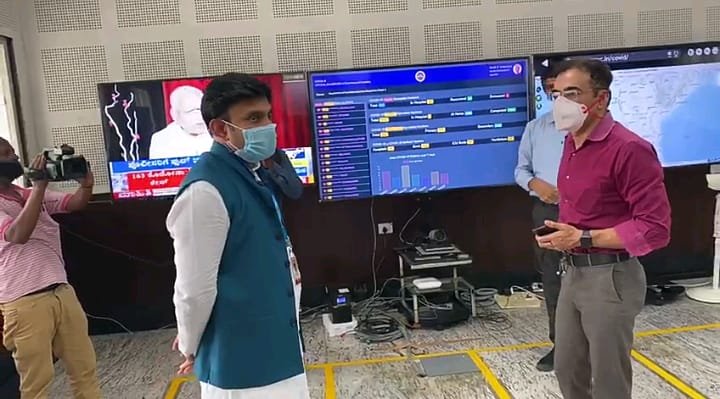 State war room chief, IAS officer Munish Moudgil with Medical Education Minister Dr K Sudhakar