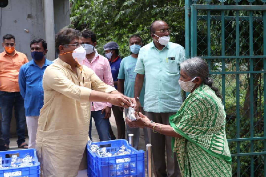 Karnataka Minister bats for continuing lockdown in state to control COVID spike 1 R Ashoka distributing food packets