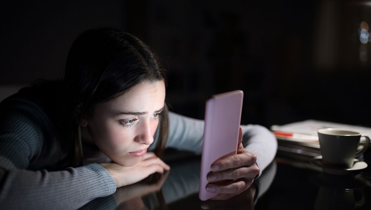 Yes, blue light from your phone can harm your skin. A dermatologist explains