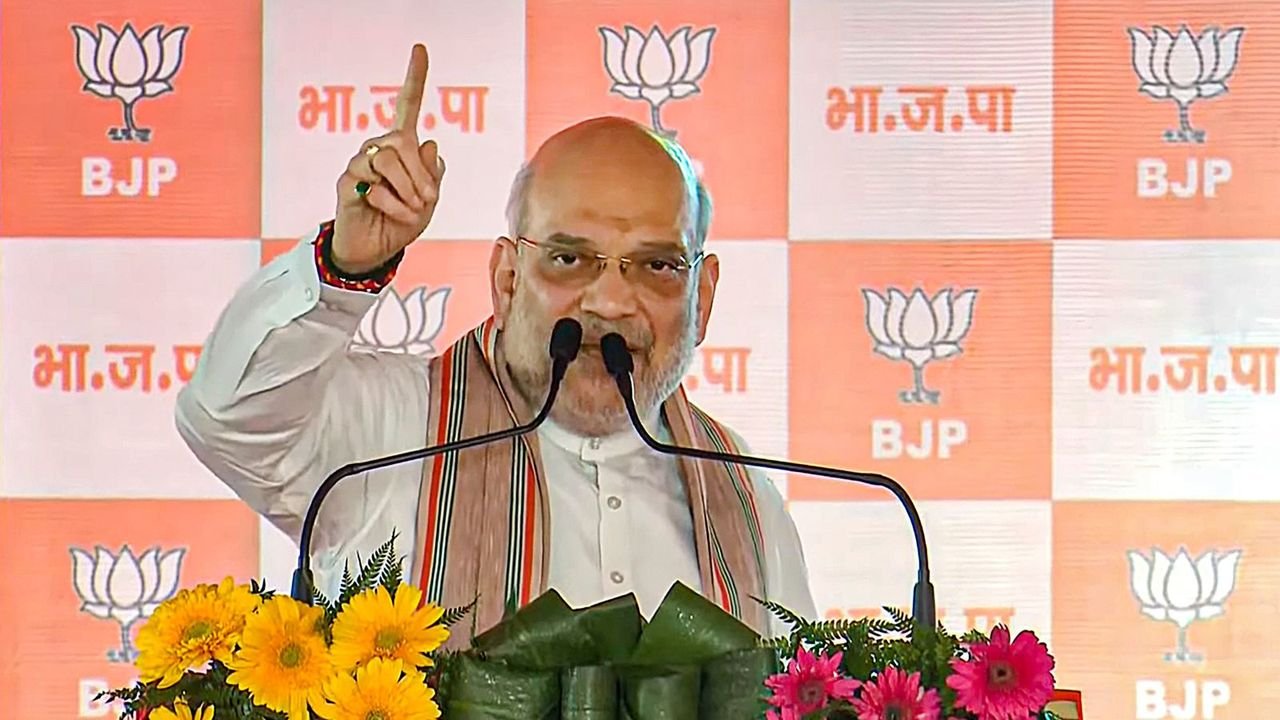 Amit Shah greets RSS volunteers as it enters 100th year